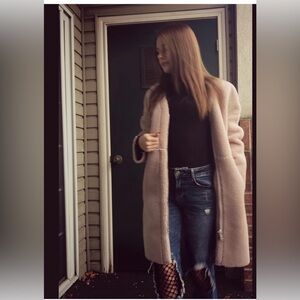 Long and heavy faux-shearling coat